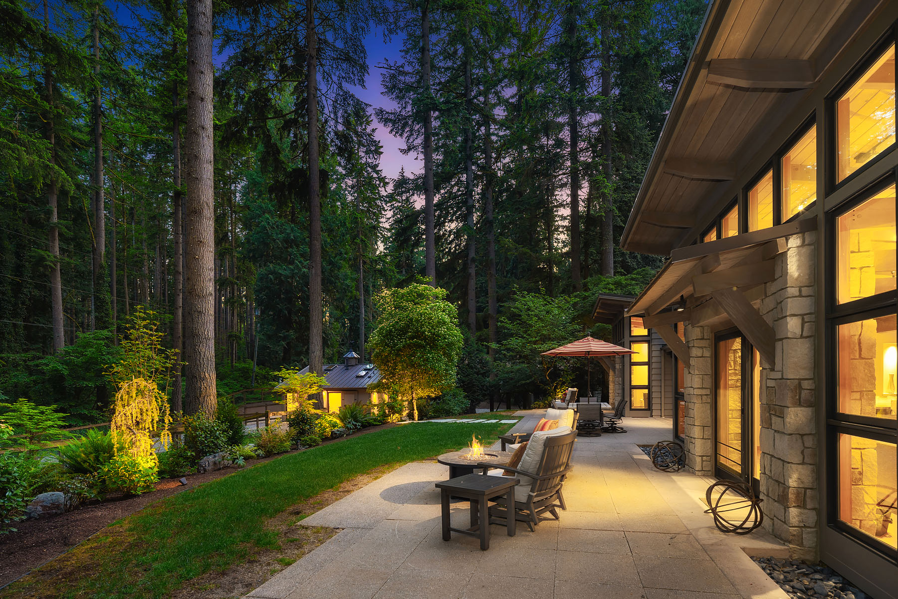 The home at twilight, the cedars rising on every side toward Bridle Trails State Park
